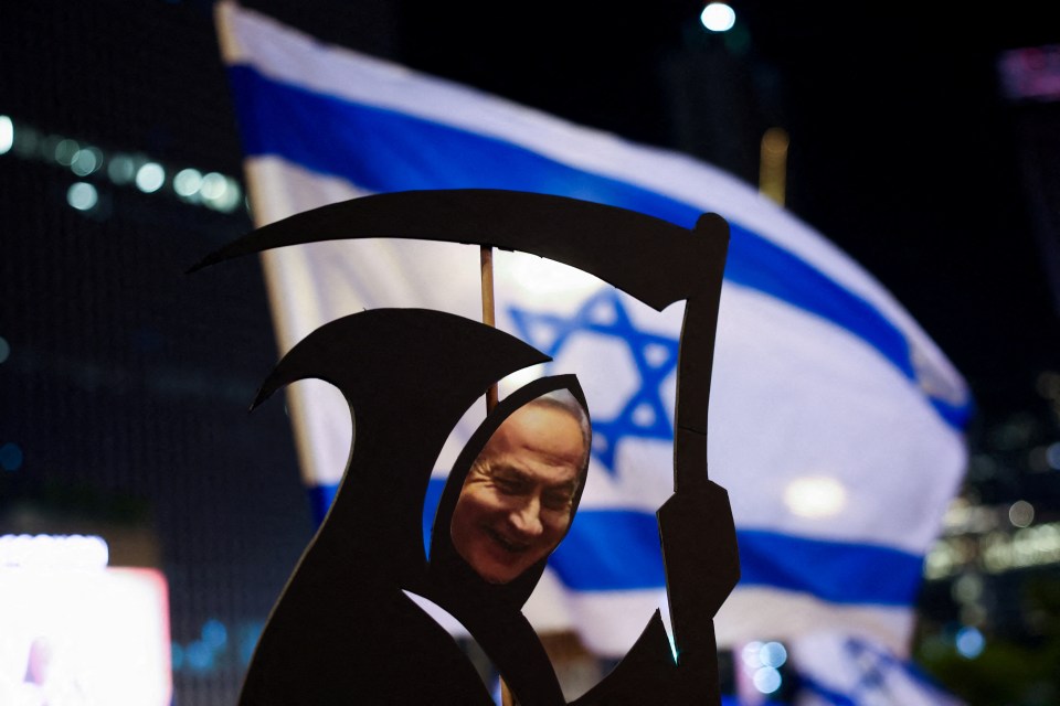 A cut-out with an image of Netanyahu dressed as the grim reaper