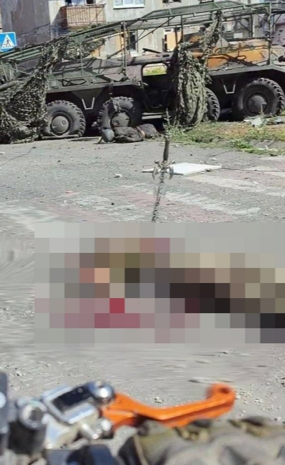 a pixelated image of a military vehicle with a crosswalk sign in the background