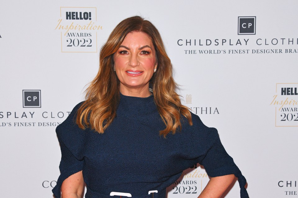 a woman stands in front of a wall that says hello inspiration awards 2022