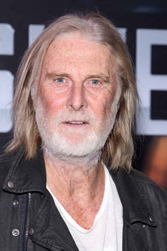 a man with long blonde hair and a white beard