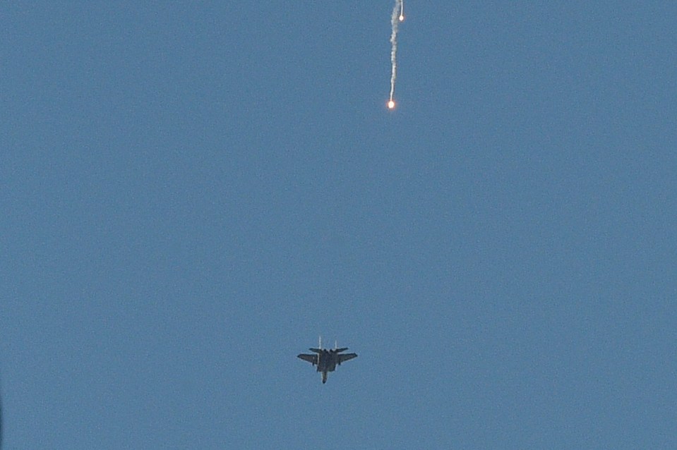 An Israeli fighter jet ejects flares over the Lebanese capital during Hassan Nasrallah's speech today