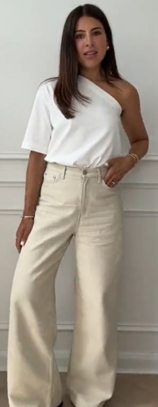 Fashion influencer at 'wearetwinset' styled the top with wide leg trousers