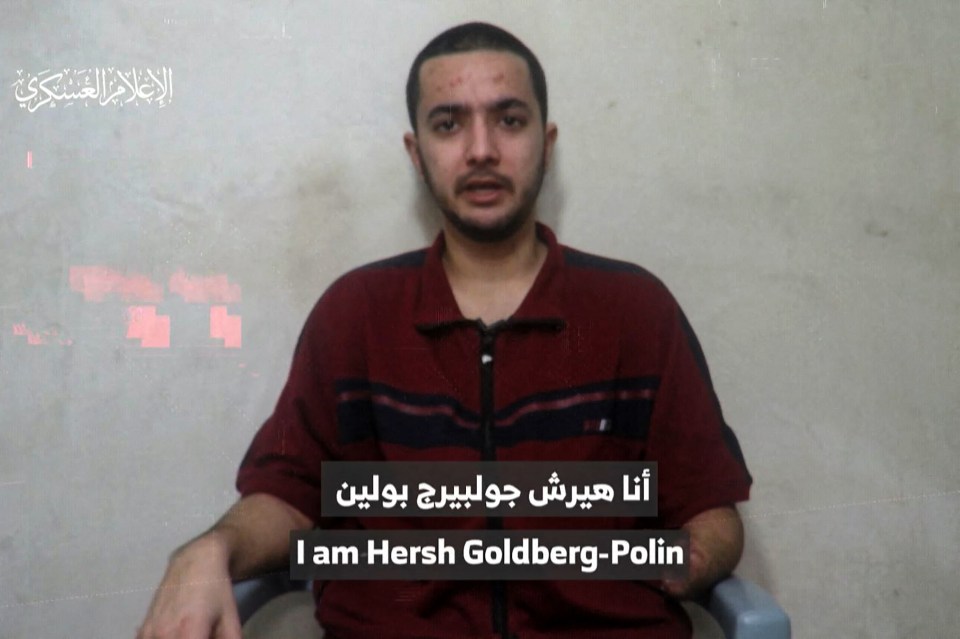 a man in a red shirt says i am hersh goldberg-polin