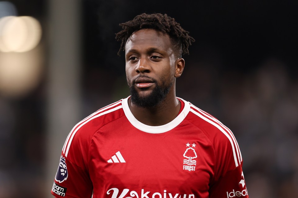 a man wearing a red shirt with the word forest on it