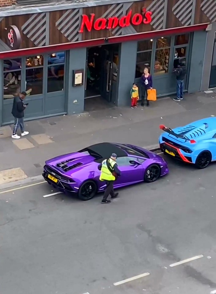 An onlooker in a block of flats opposite filmed the bizarre moment