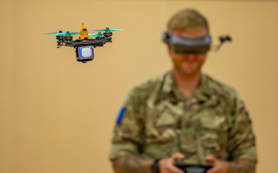 Paratrooper flying a custom five-inch drone using first person view (FPV) goggles