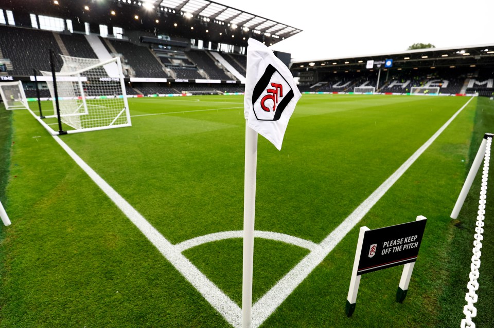 a soccer field with a sign that says please keep off the pitch