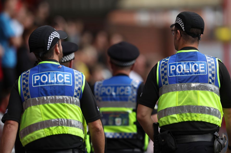 A record 125 police officers were assaulted every day last year as Yvette Cooper branded the figures a 'stain'