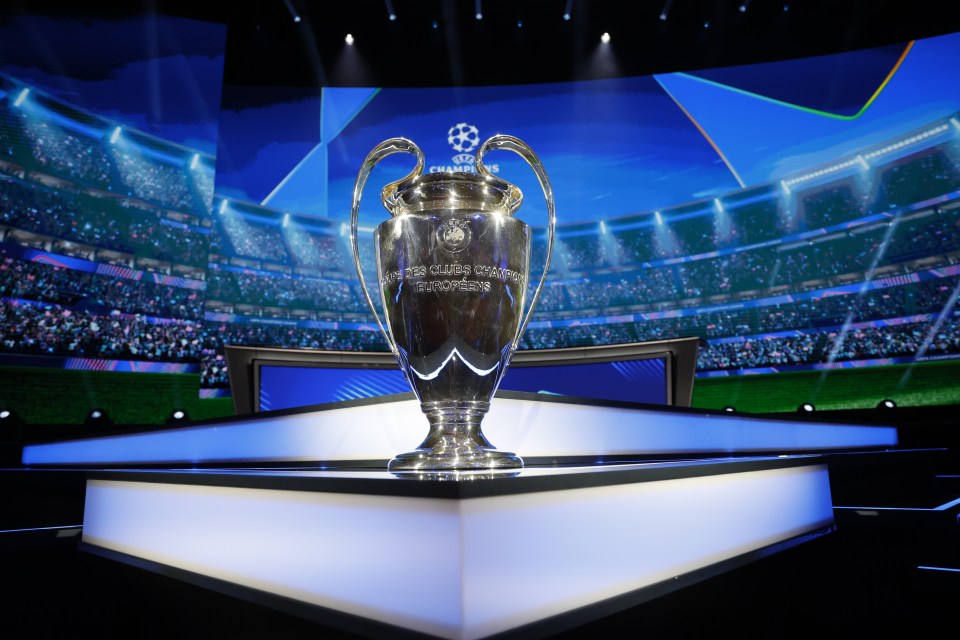 a silver trophy that says champions league on it