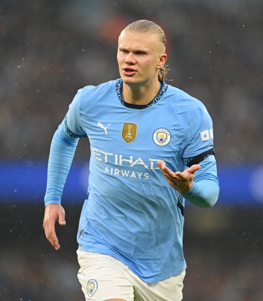 a soccer player wearing a blue shirt that says etihad airways