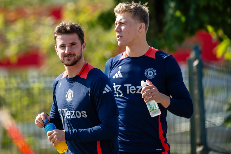 two soccer players wearing blue shirts with tezos on them