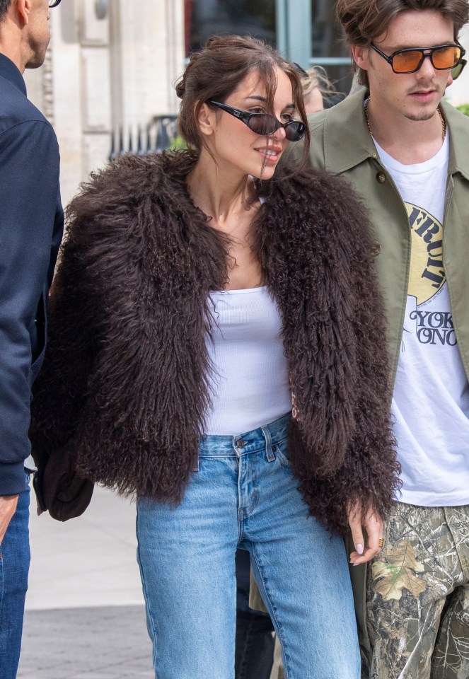 Jackie exuded effortless chic in a similar stylish brown fur coat