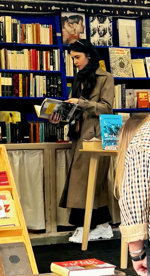 The actress covered up with a chic trench coat and contrasting scarf for her stroll around Shepherd's Bush Market