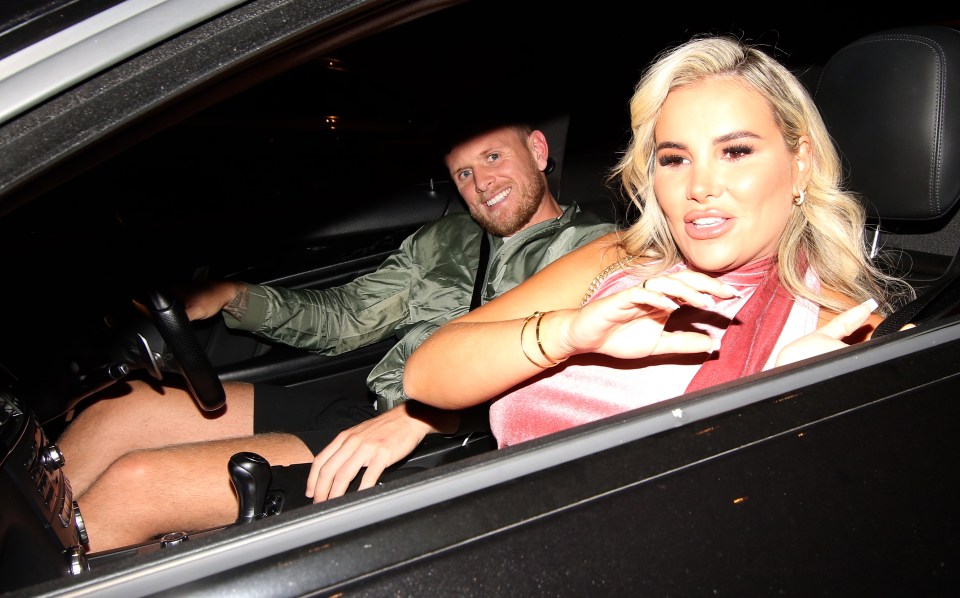 a man and a woman are sitting in a car