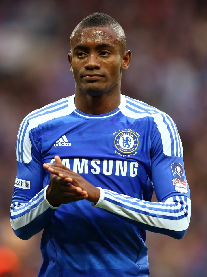 a man wearing a blue samsung jersey applauds