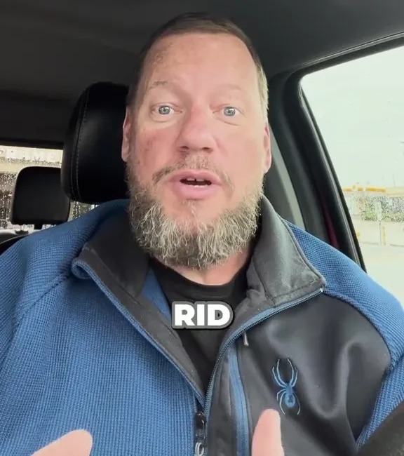 a man with a beard wearing a jacket that says rid