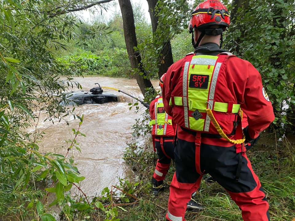 Fire crews from Red Shrewsbury rescuing a man from flood water in Condover