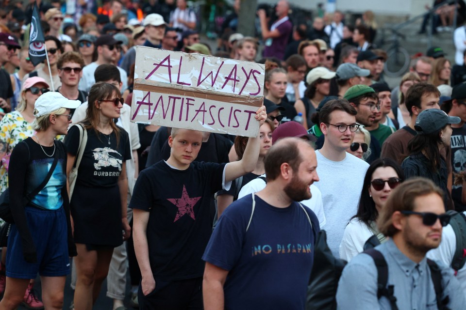 Protestors held banners reading "Always antifascist"