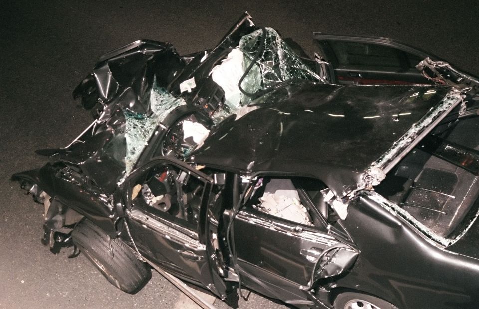 a black car with a broken roof and door