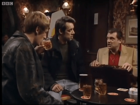 three men sitting at a table with bbc written on the bottom