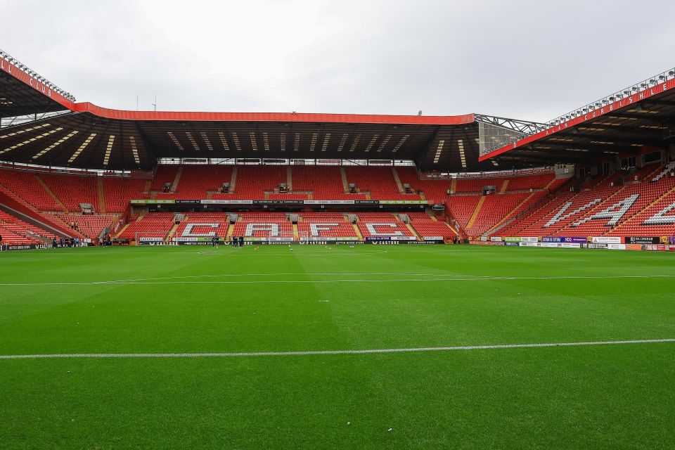 an empty soccer stadium with the letters caf on the stands