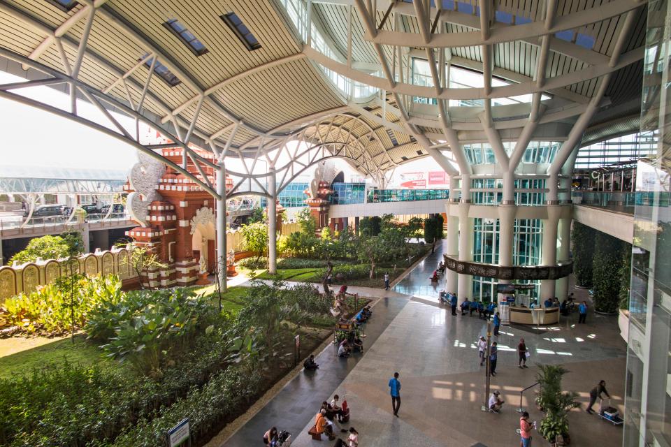 a large building with a sign that says ' arrivals ' on it