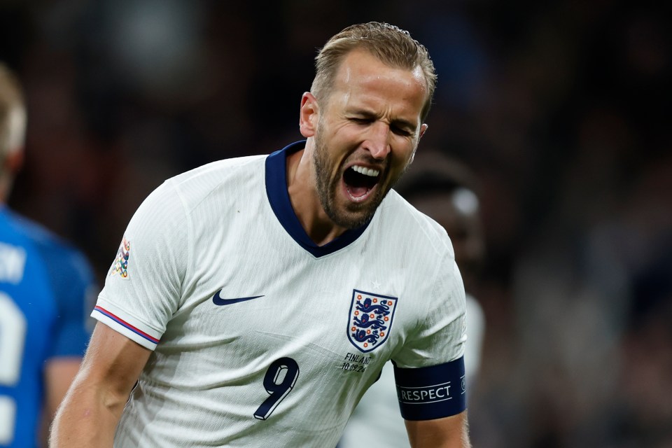 soccer player wearing a white jersey with the number 9 on it