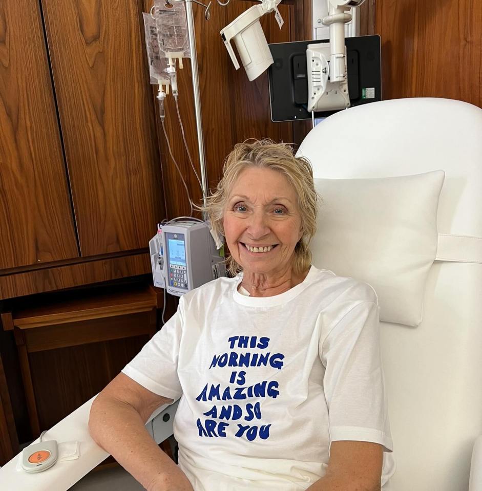 a woman in a hospital bed wearing a t-shirt that says this morning is amazing and so are you