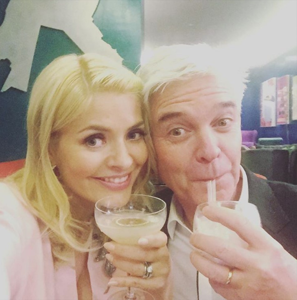 Holly and Phil at the NTAs, sipping drinks