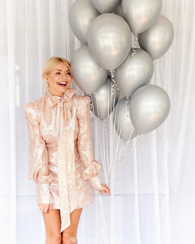 Holly with a balloon for her wellness brand Wylde Moon’s birthday