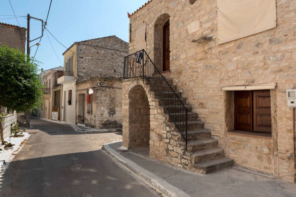 a stone building with stairs leading up to it