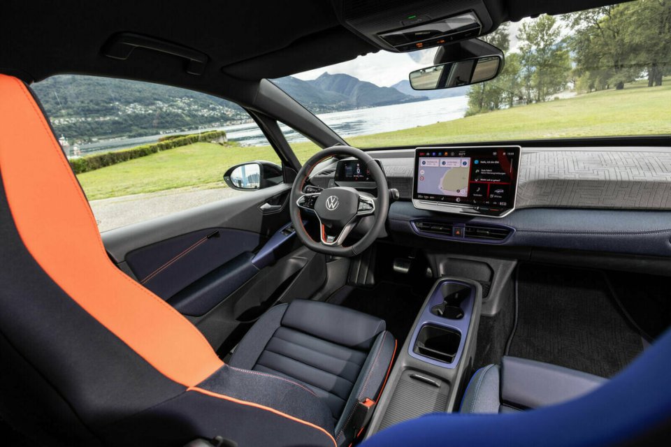 the interior of a volkswagen car with a large screen on the dashboard