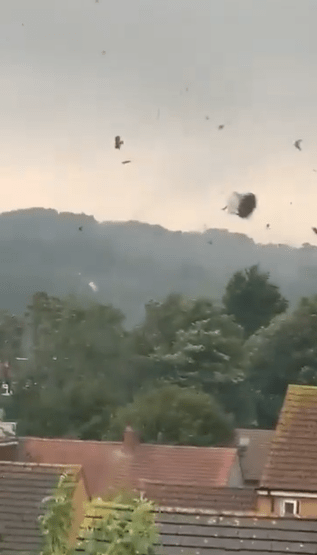 Video taken in Luton showed a 'mini-tornado' launching debris into the air