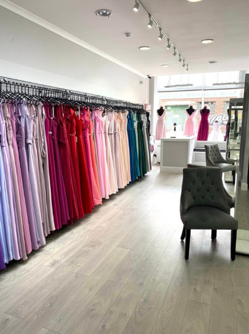 a store filled with lots of different colored dresses