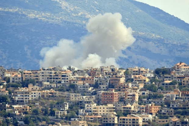 Smoke billows from the site of an Israeli airstrike in Khiam, southern Lebanon