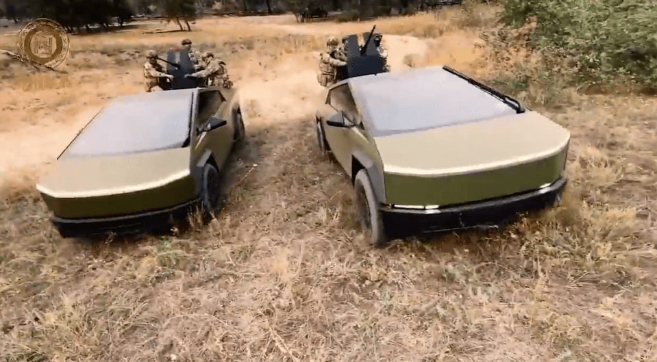 two military vehicles are parked in a field with a sign that says ' u.s. army ' on it