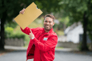 a man in a red jacket with the word priority on it