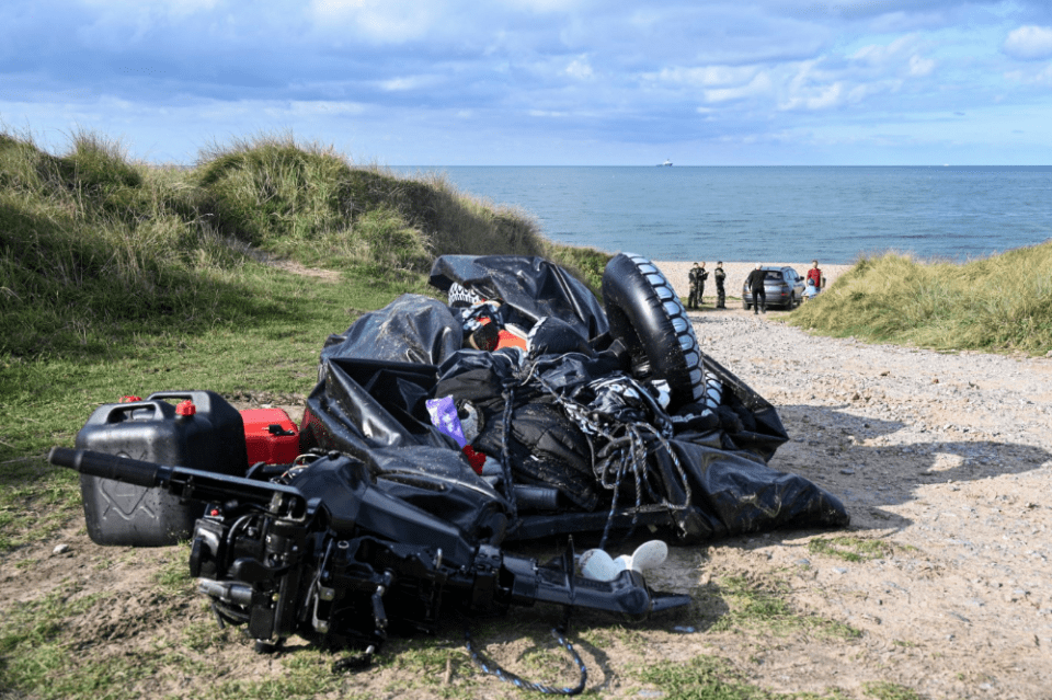 A damaged boat after a failed attempt to cross the English Channel that led to the death of 8 people near the beach of Ambleteuse