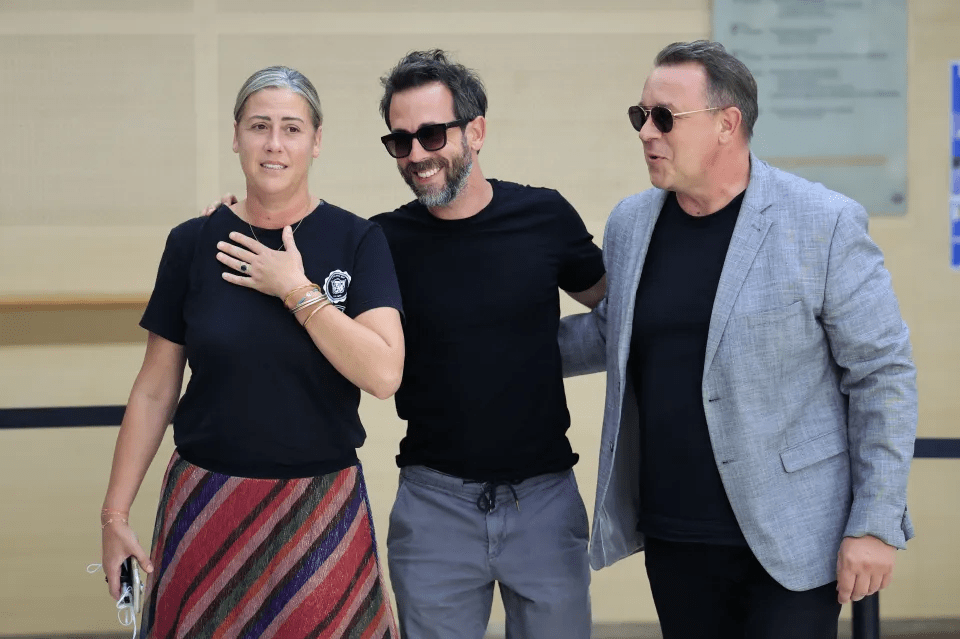 The sons of Gisele Pelicot, Florian (C), David (R) and her daughter Caroline Darian (L) arrive at the criminal court