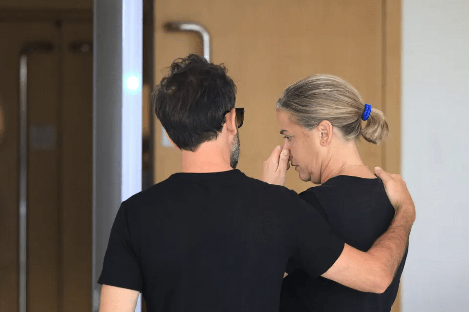 Caroline Darian (R) in tears while leaving the criminal court in Avignon