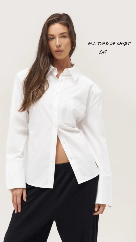 a woman wearing a white tie up shirt and black pants