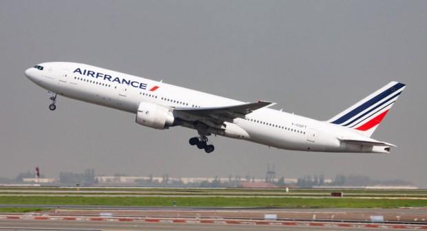 an airfrance plane is taking off from a runway