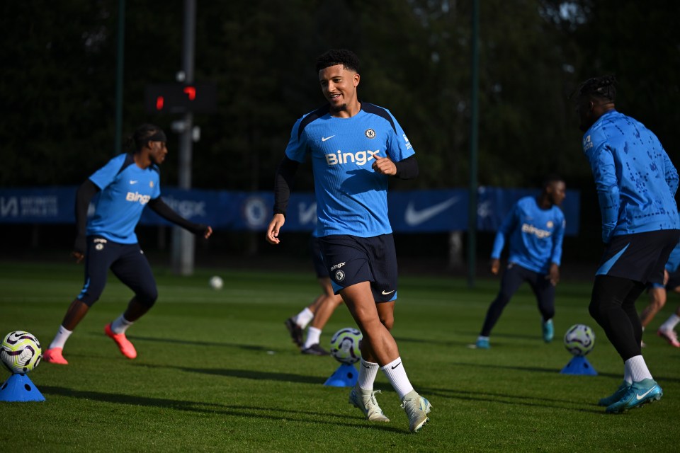 a soccer player wearing a blue shirt that says bingx