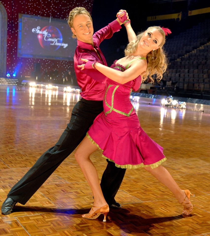 a man and woman are dancing in front of a screen that says south carolina dancing