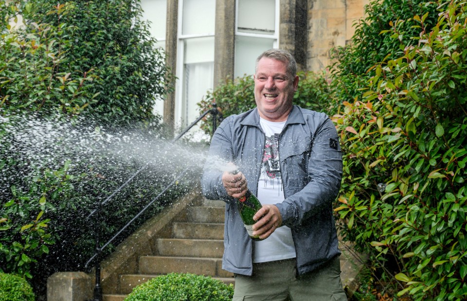 John splashed champagne after the big win