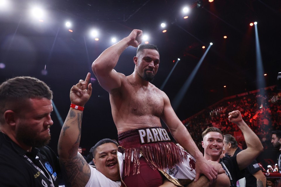 a man in a boxing ring with the word parke on his belt