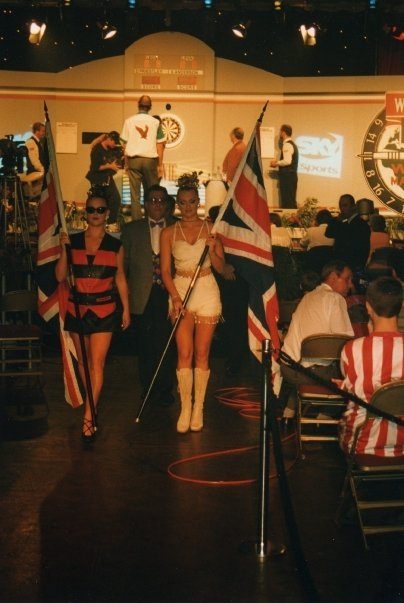 a group of people holding flags in front of a sign that says snooker