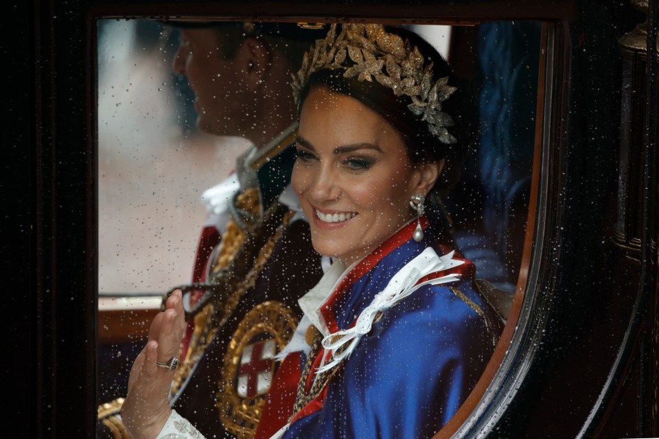 a woman wearing a tiara and earrings is smiling