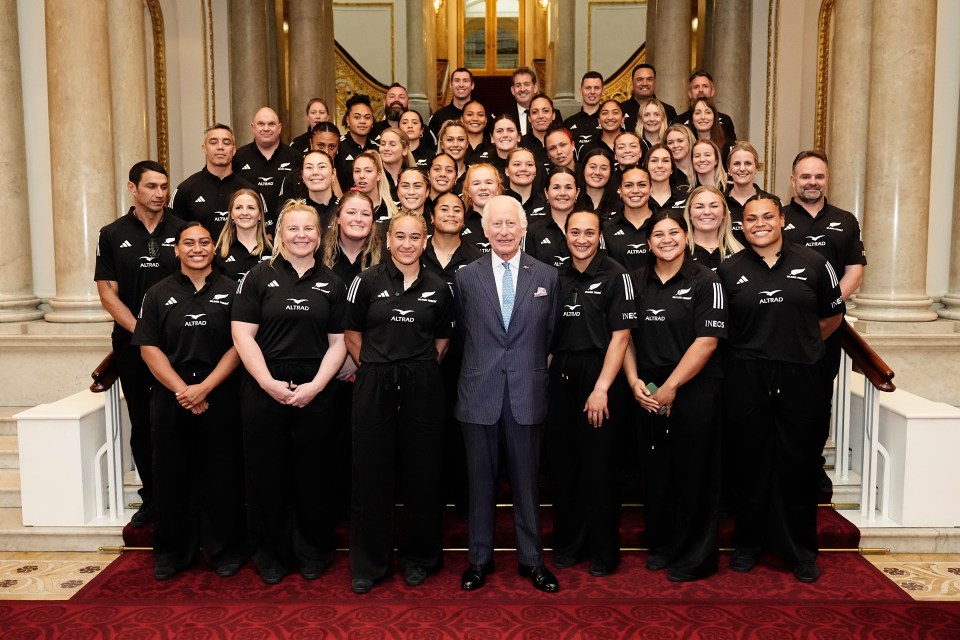 Charles with the Black Ferns rugby union team on the Grand Staircase