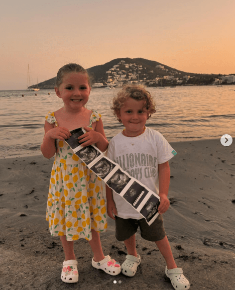 a boy wearing a billionaire boys club shirt stands next to a girl